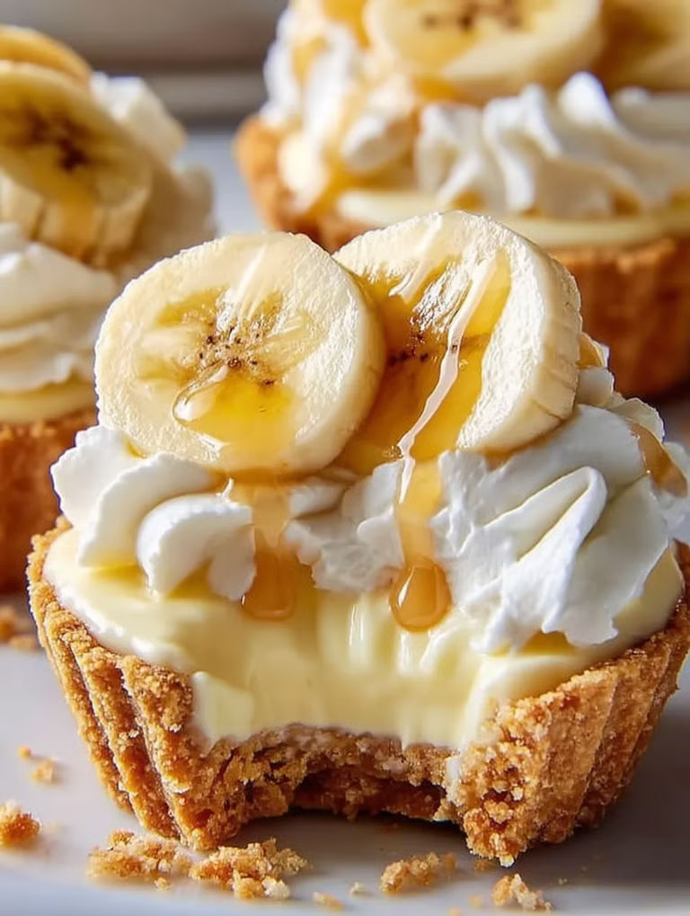 A dessert with bananas and cream.