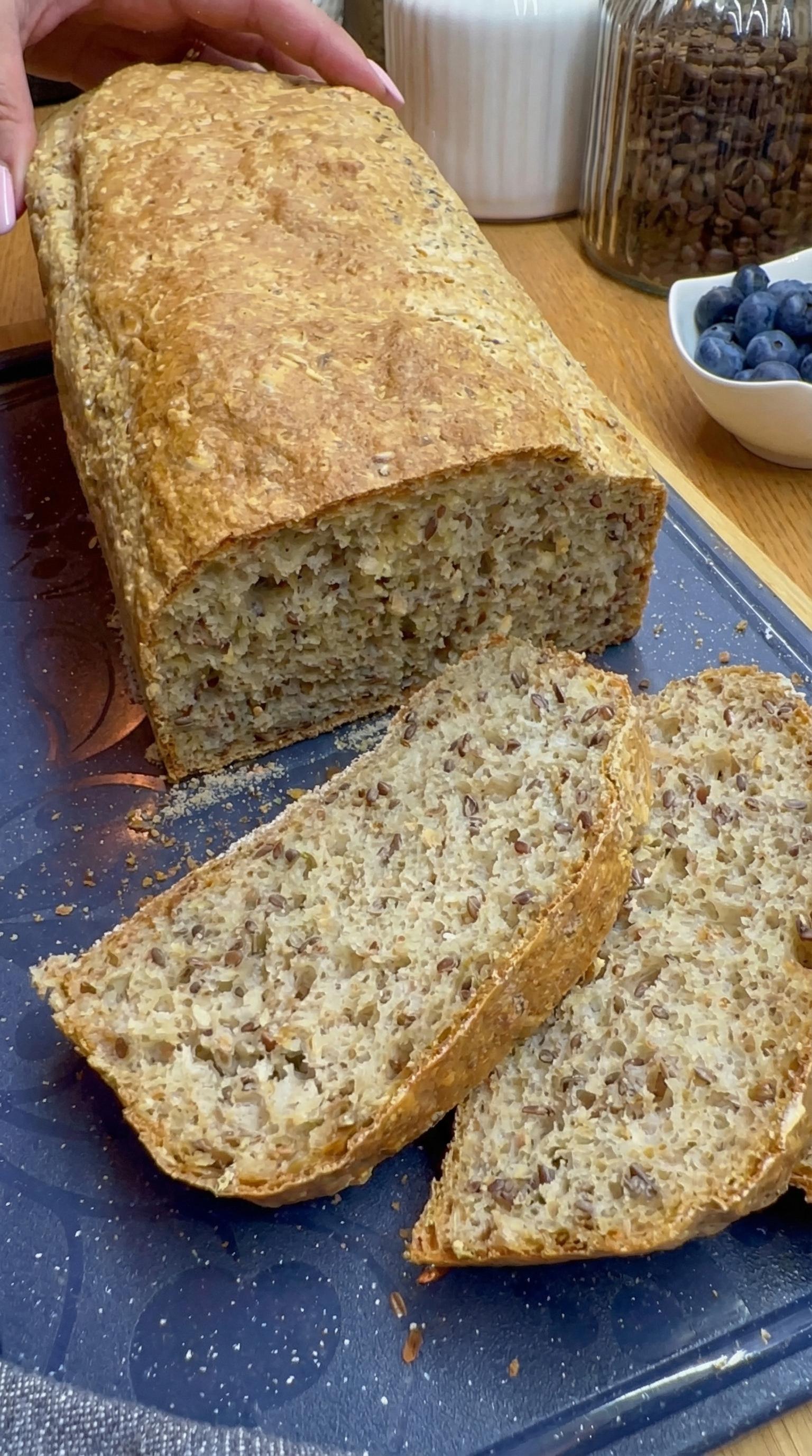 A loaf of bread with a blueberry on top.