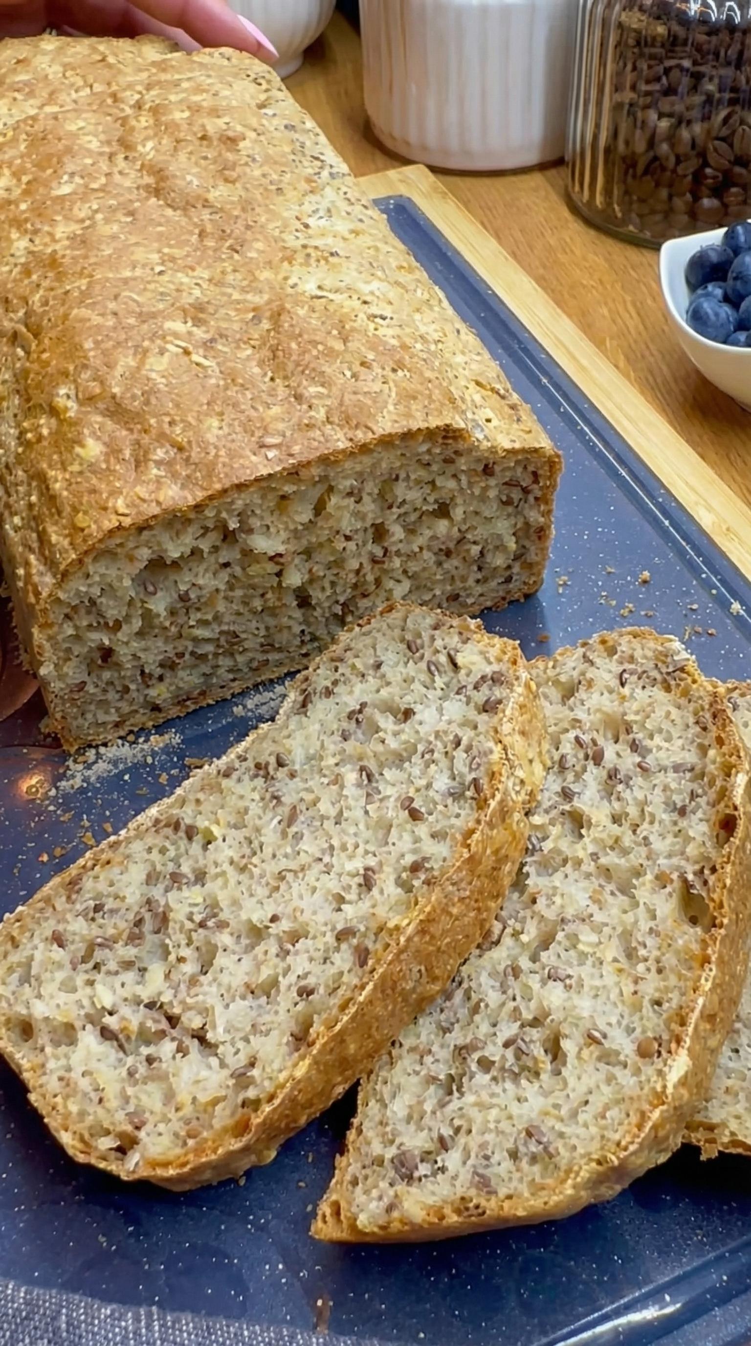 A loaf of bread with a blueberry on top.