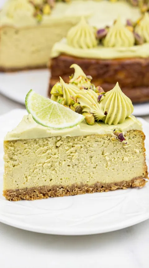 A slice of cake with a lime wedge on top.