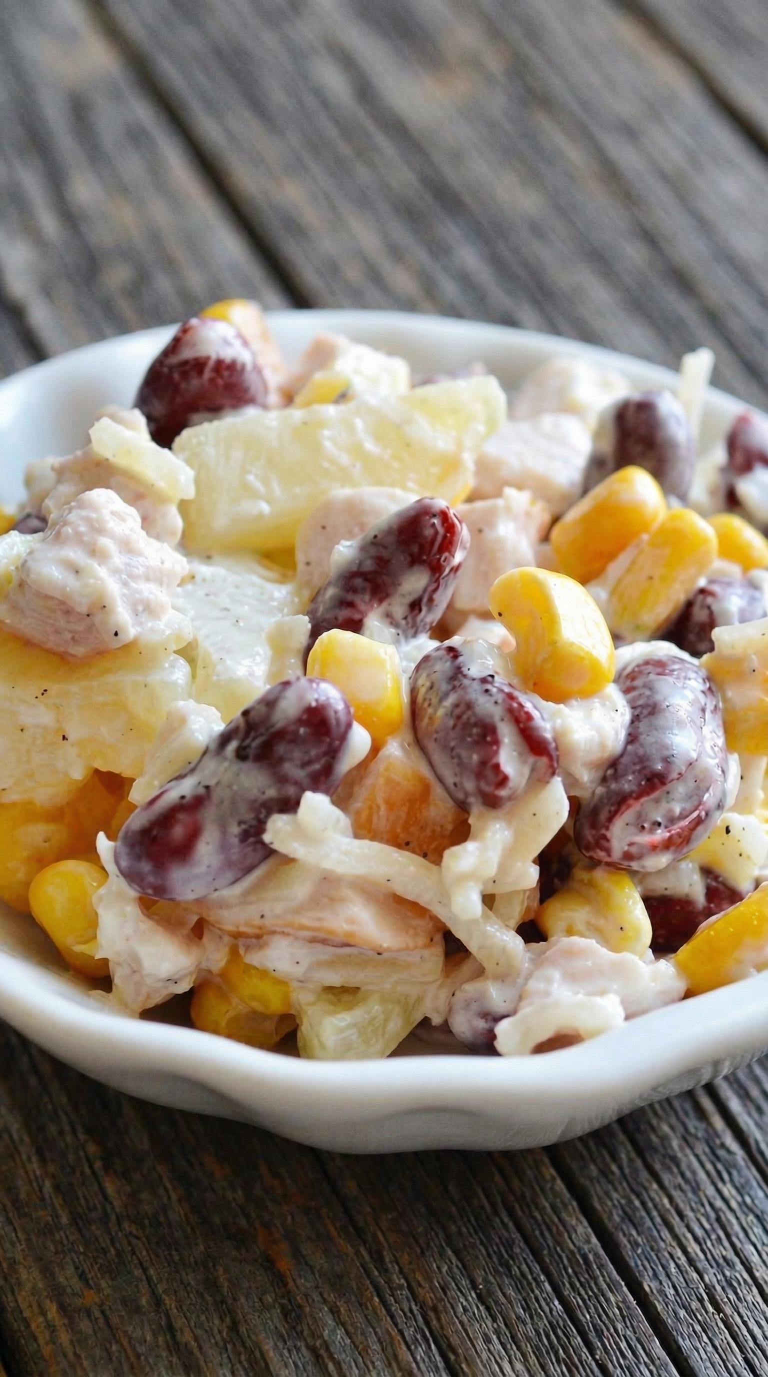 A white bowl filled with a salad.