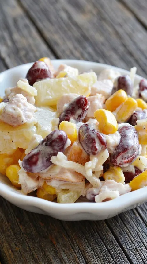 A white bowl filled with a salad.