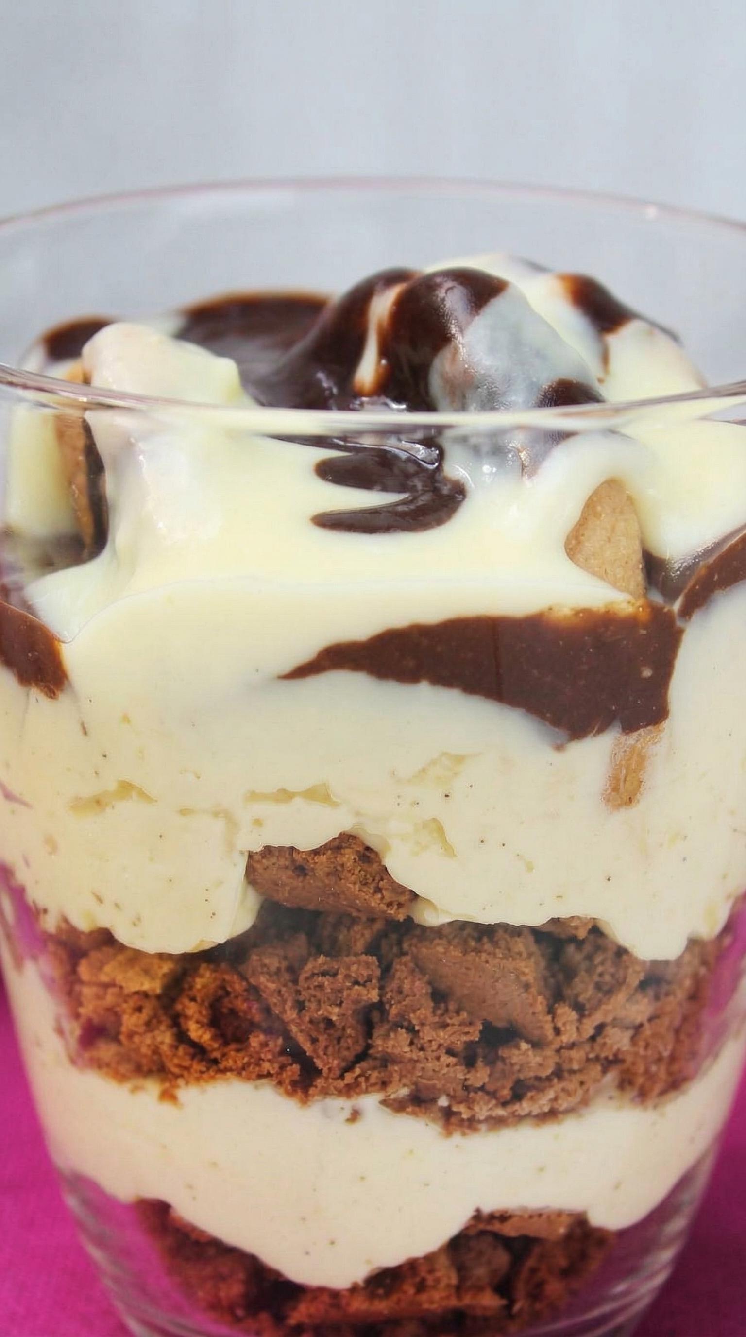 A dessert with chocolate and white cream.