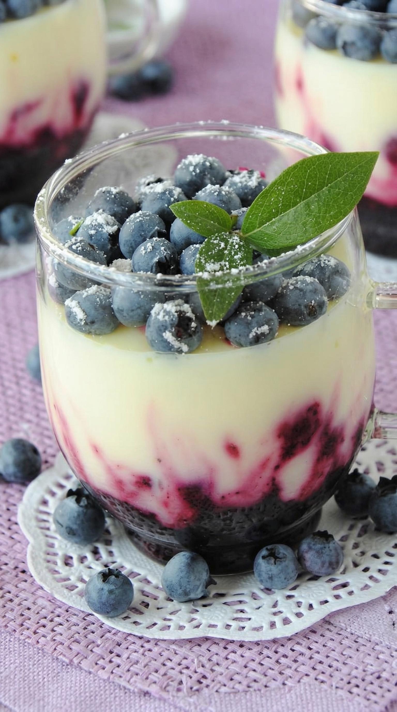 A glass of blueberry dessert.