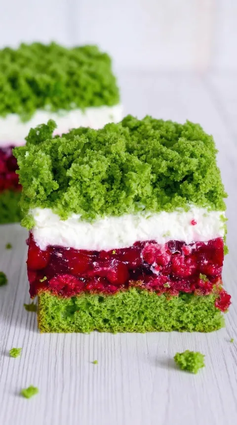 A slice of green and white cake.