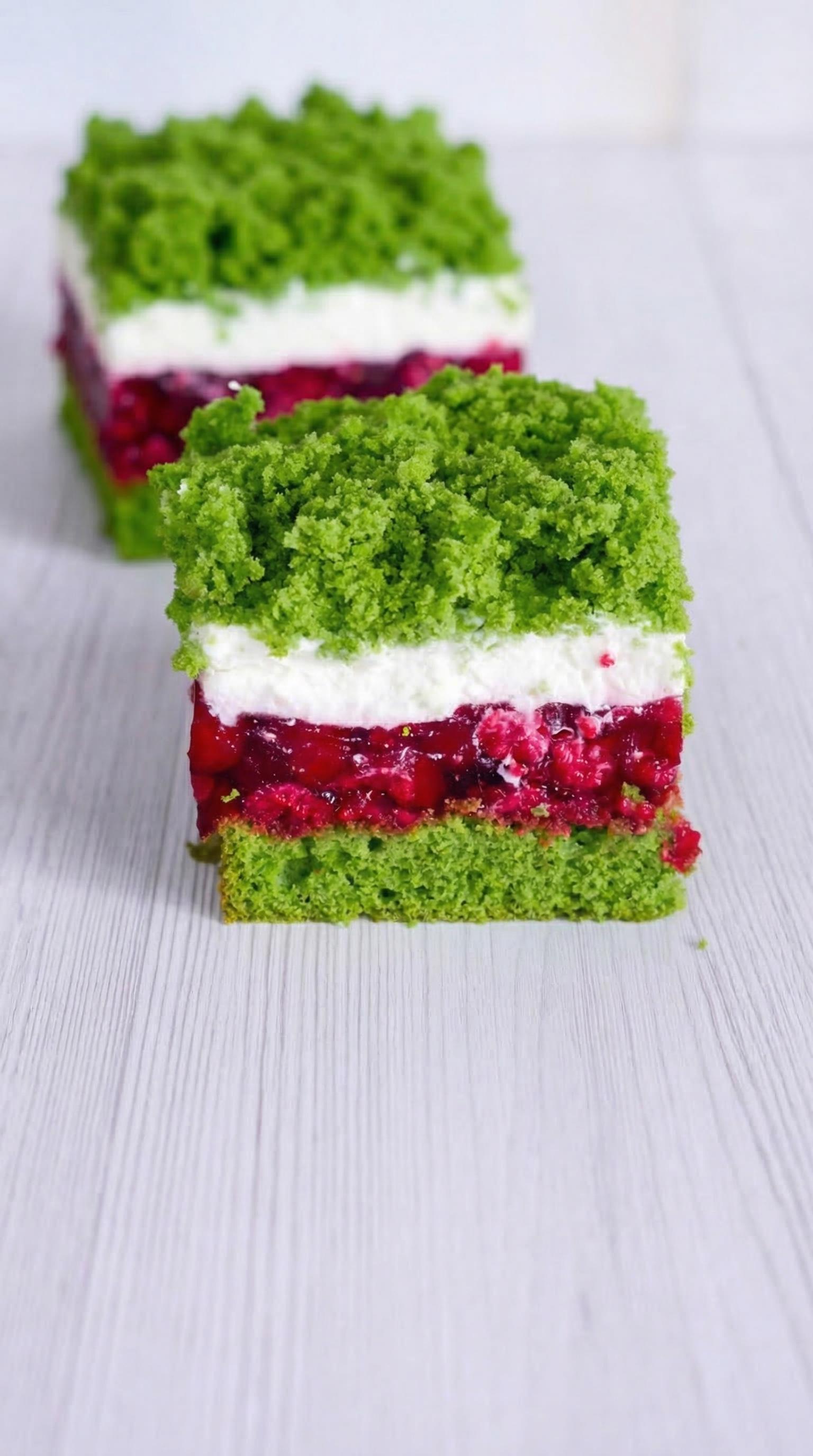 A slice of cake with green frosting.