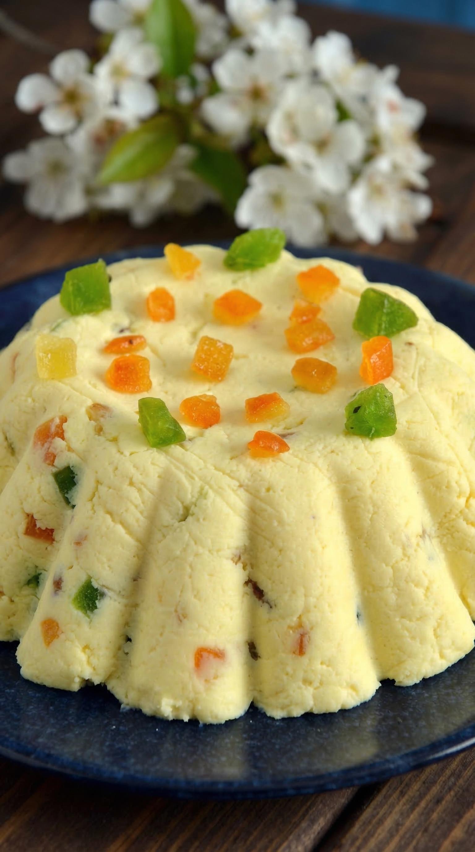 A pascha cake with fruit on top.