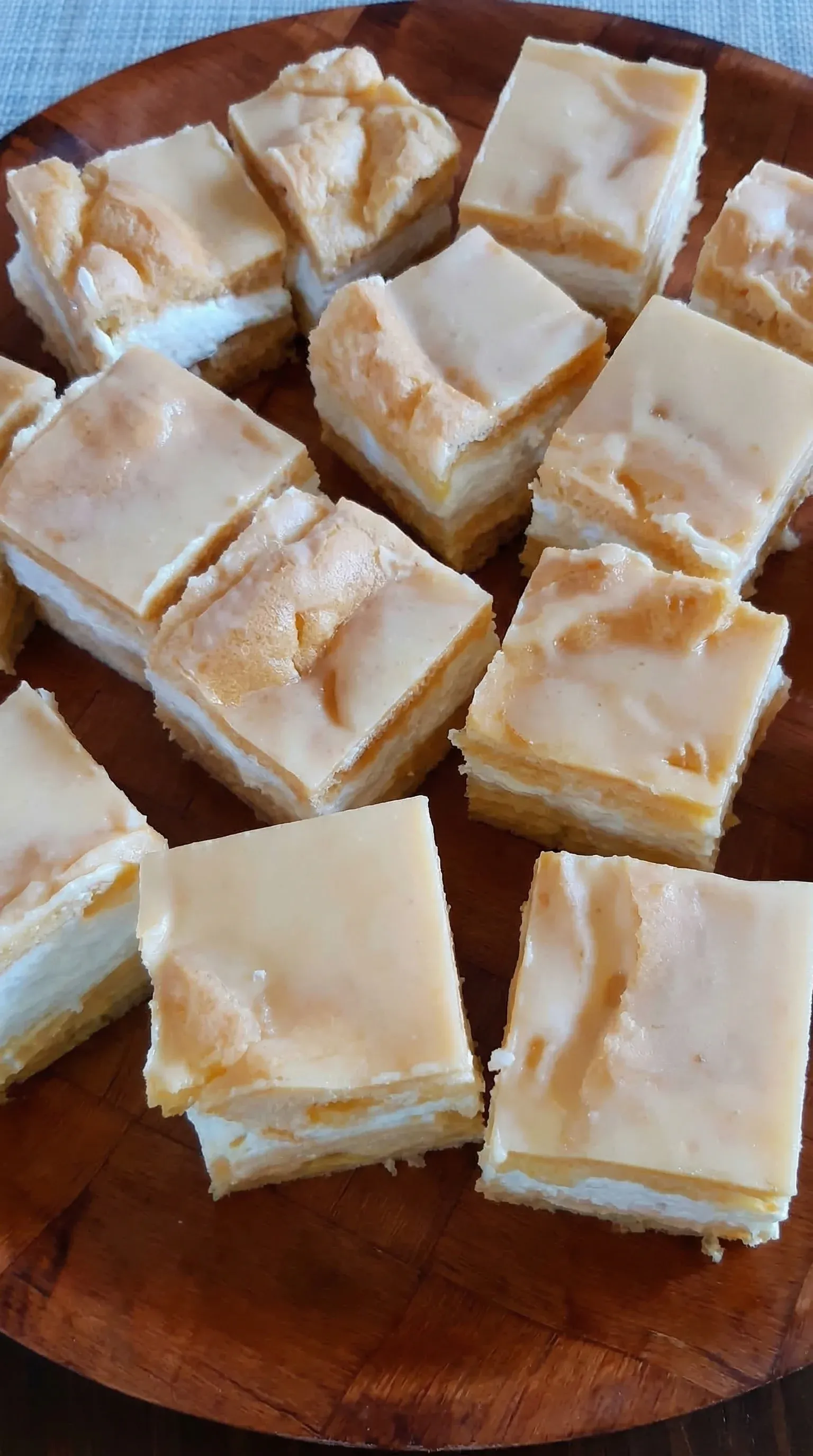 A plate of cake with a slice missing.