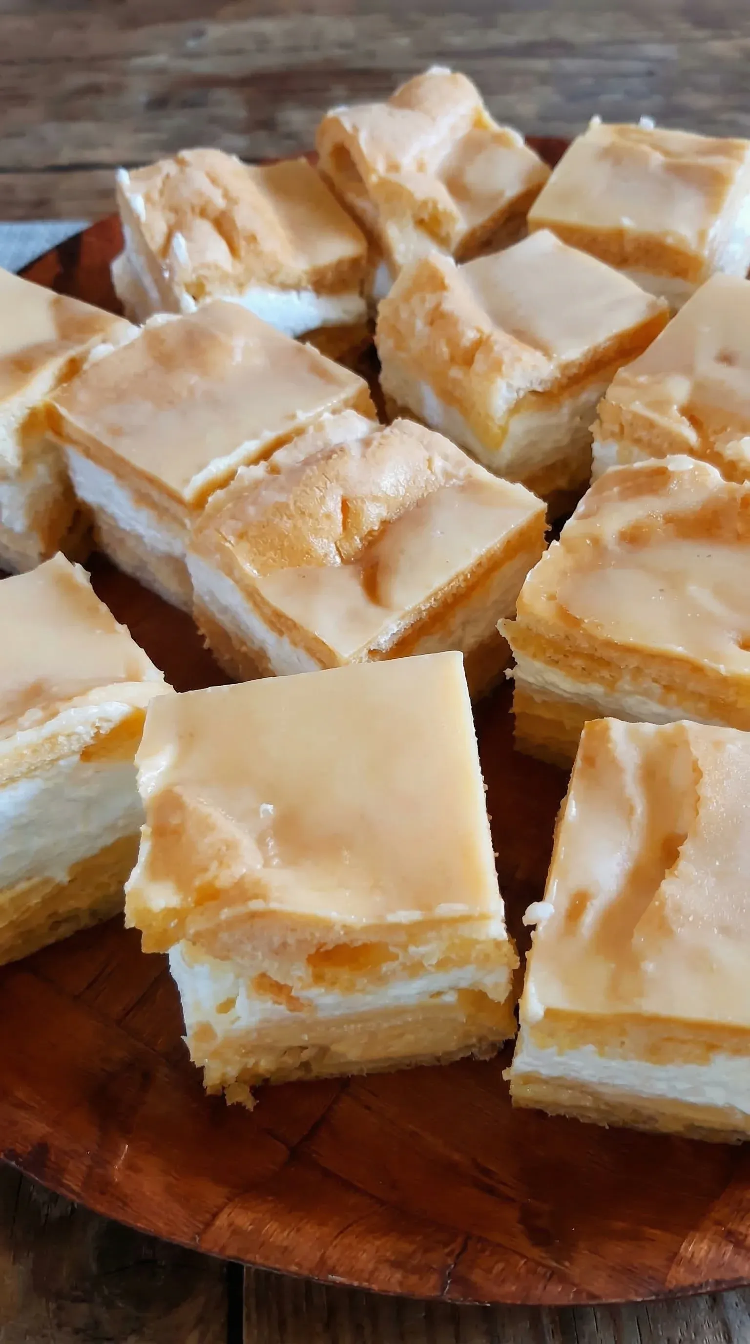 A close up of a dessert with a yellow icing.