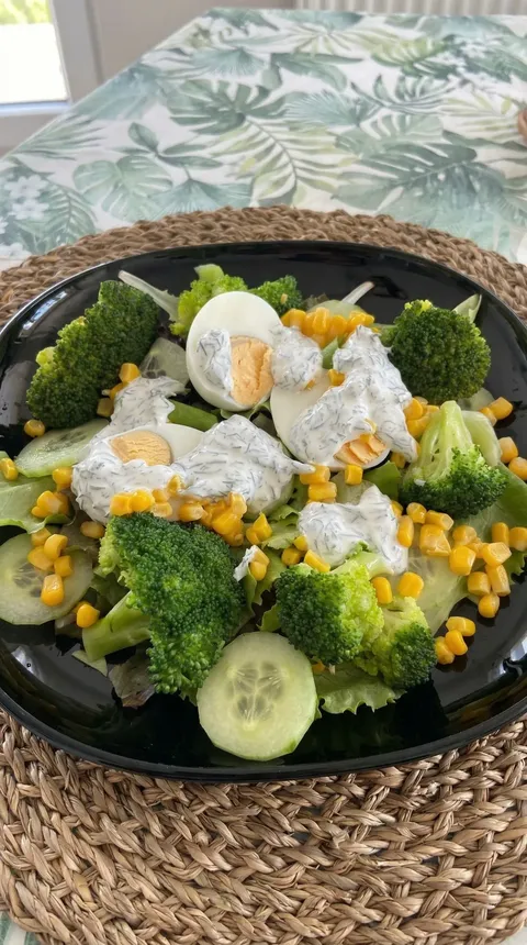 A plate of food with broccoli and eggs.