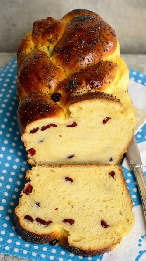 A slice of bread with raisins on it.
