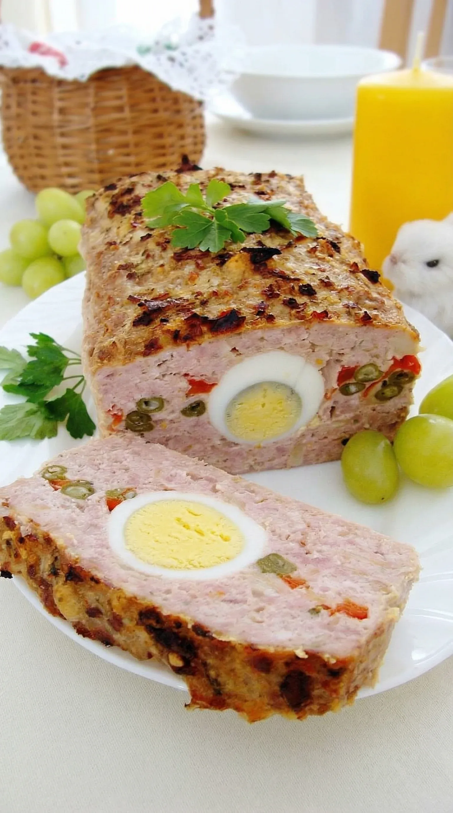 A slice of meat with an egg in the middle.