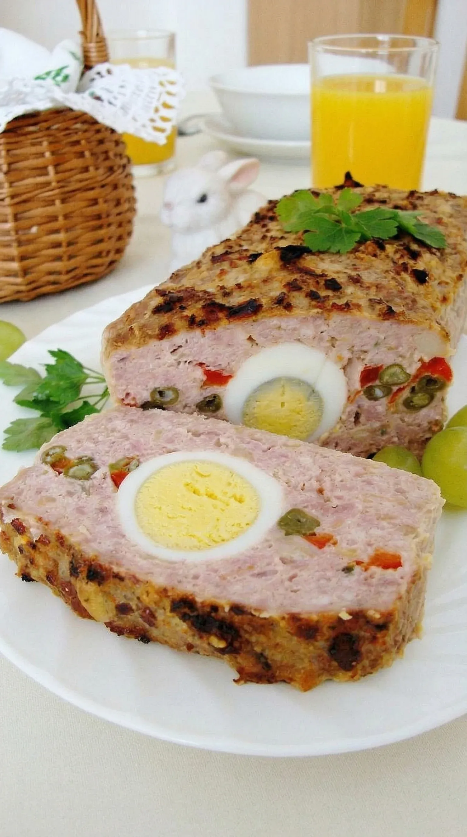 A delicious looking meat dish with an egg in the middle.