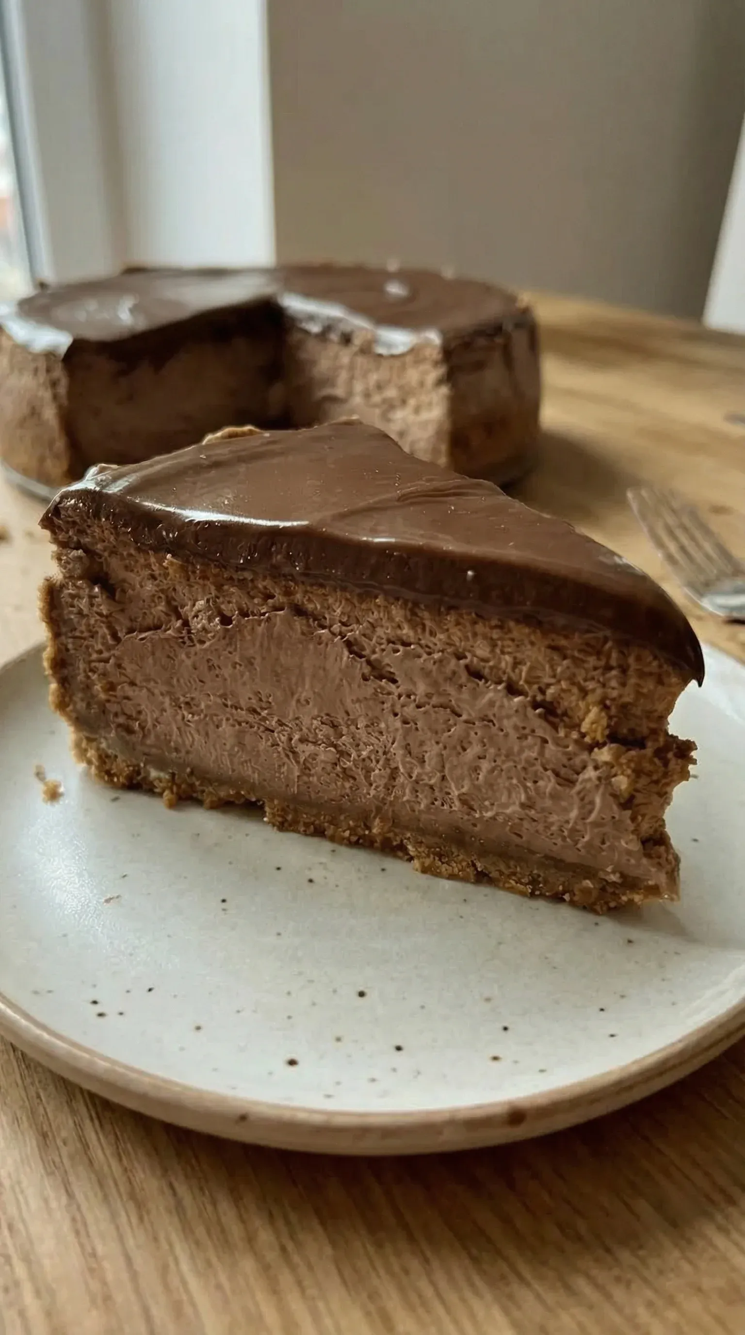 A slice of chocolate cake on a plate.
