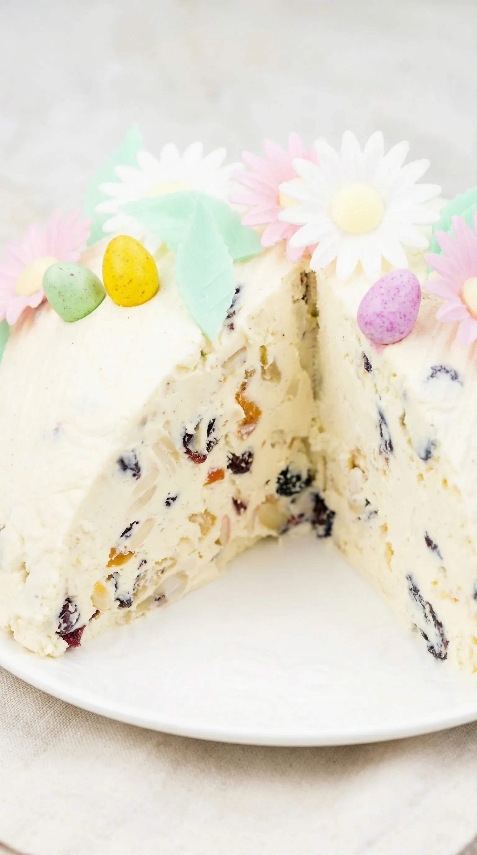 A slice of pascha wielkanocna cake with berries and nuts.
