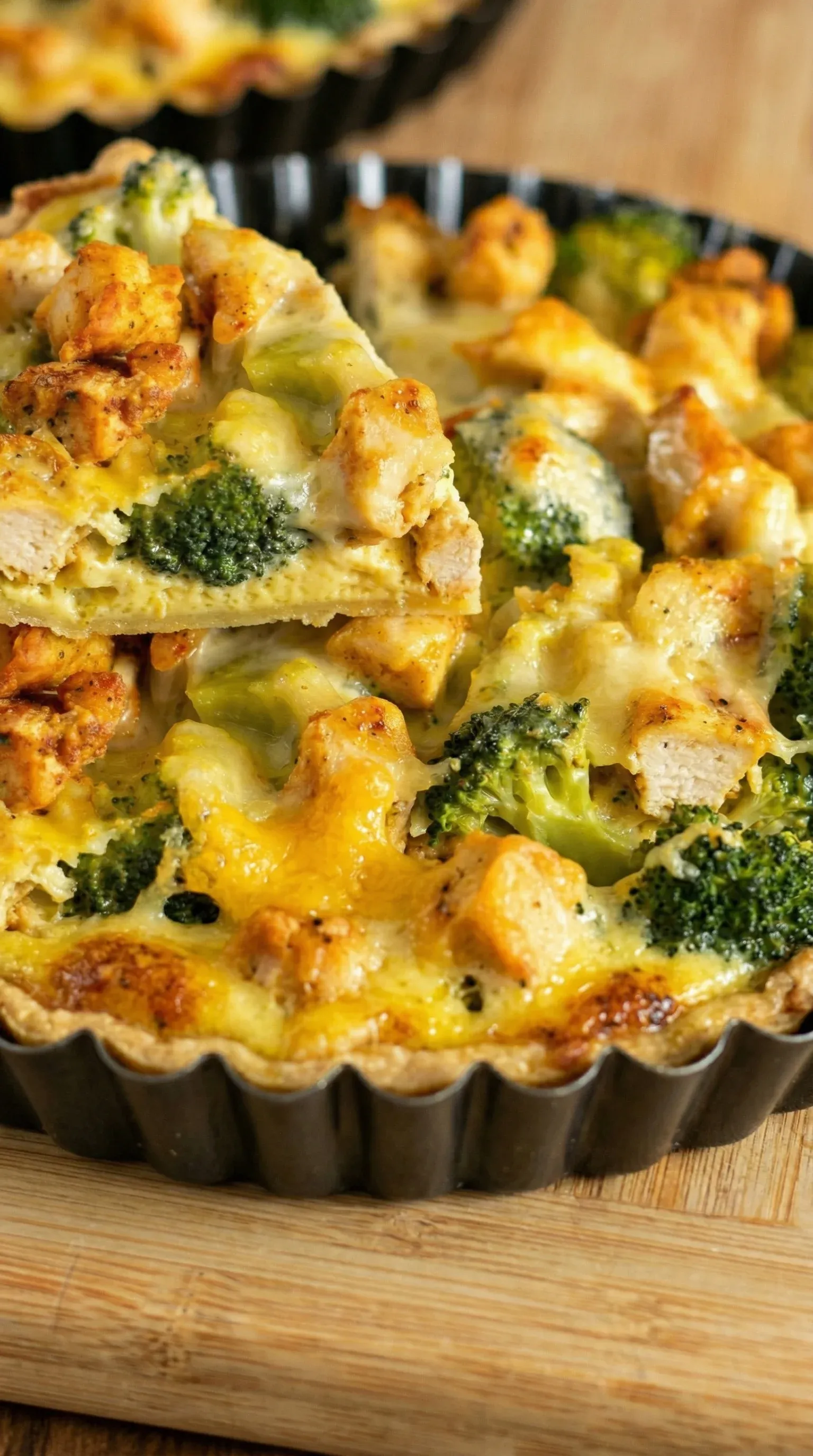 A pie with broccoli and chicken.