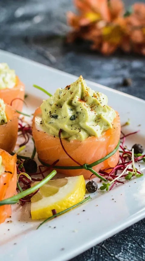 A plate of food with a slice of lemon on it.