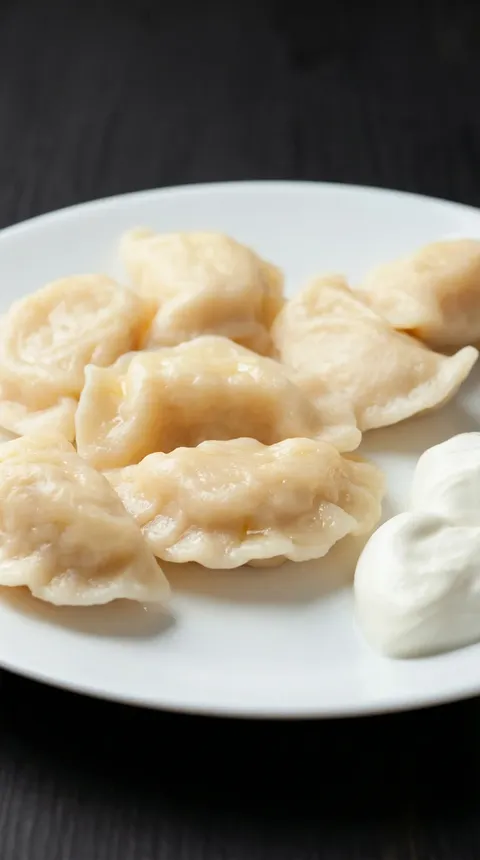 Pierogi Ruskie on a white plate.