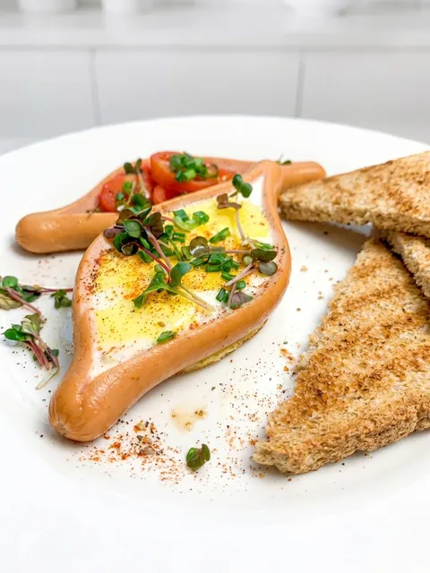 A plate of food with a hot dog and toast.
