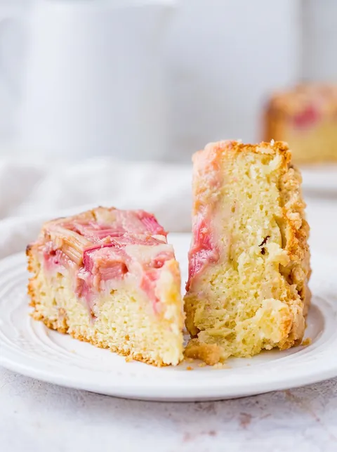 A slice of cake with strawberry and cream filling.
