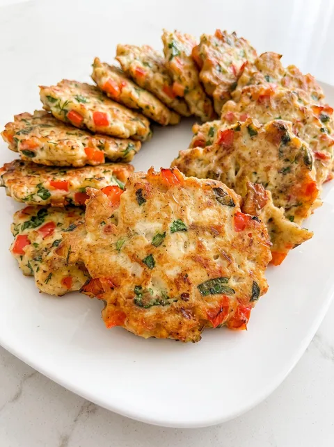 A plate of food with a variety of colors.
