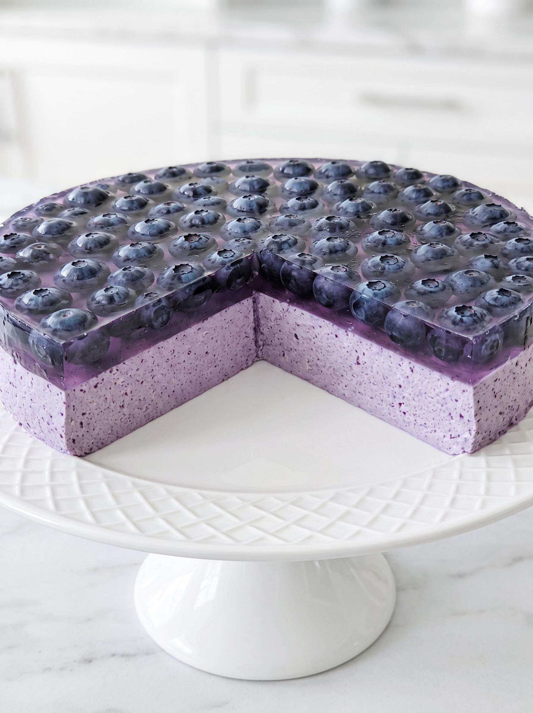 A slice of blueberry cheesecake on a plate.